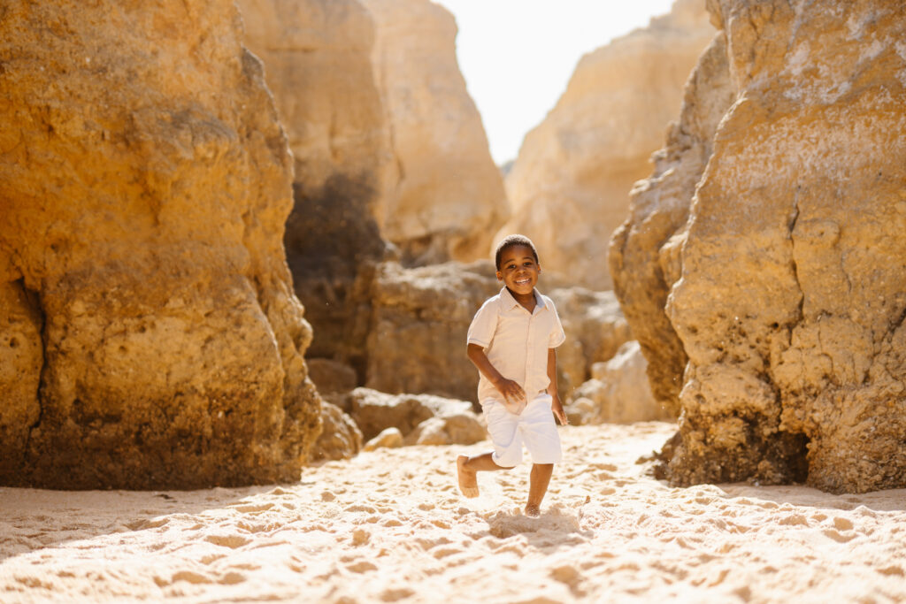 boy running on the beach Algarve