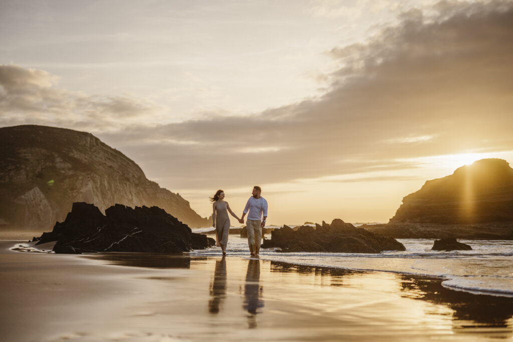 A couple holding hands at the beach