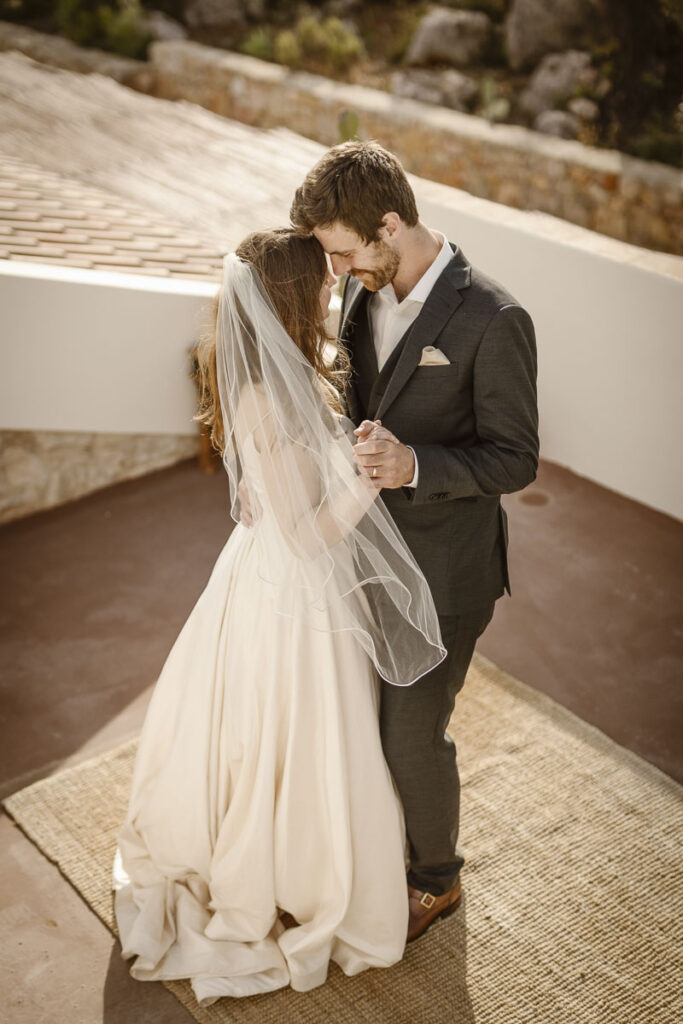 Bride and groom dance at the rooftop in Loule, Portugal.