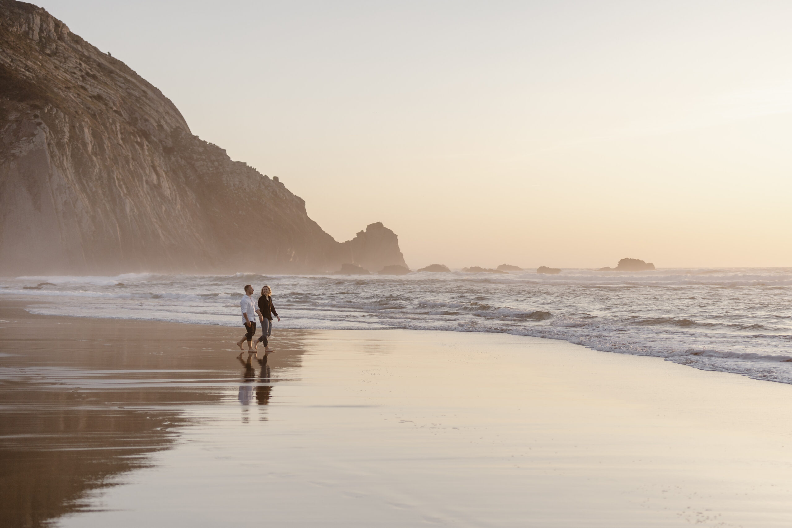 People Walking on the beach in west coast of Algarve , Portugal.