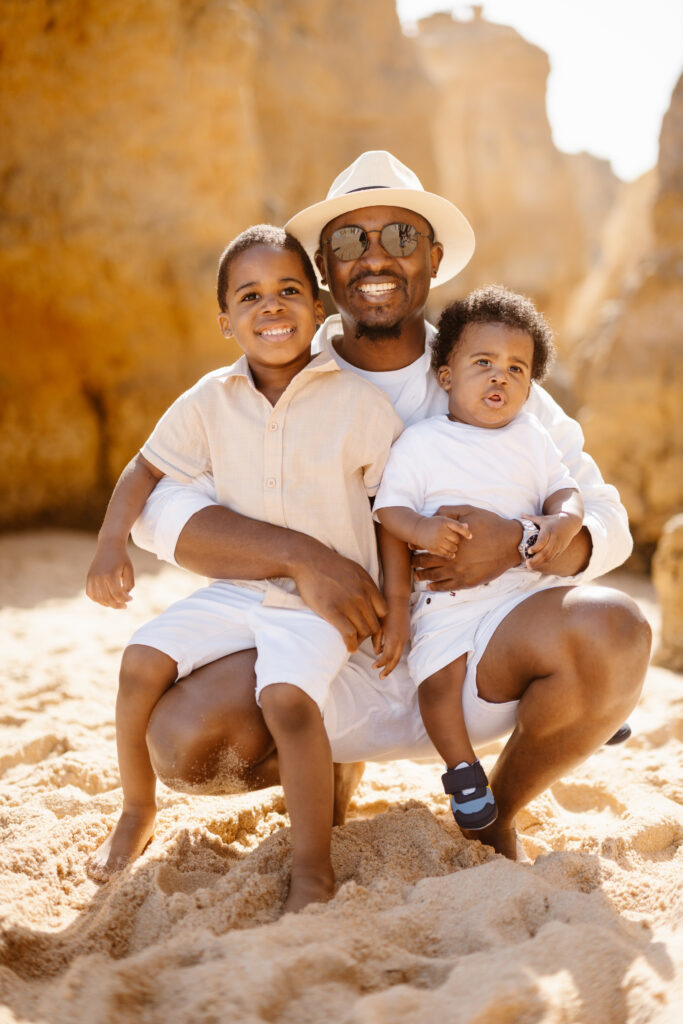 Father with two sons on the beach