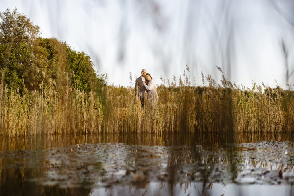 Couple by the pond in portugal during engagement photoshoot