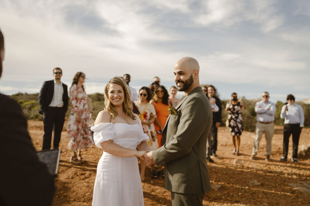 Bride and groom stand at alter in Alvor, Portugal