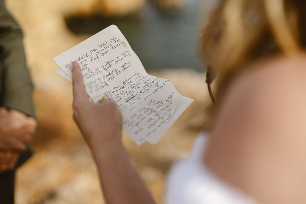 Bride reads wedding vows in Alvor, Portugal