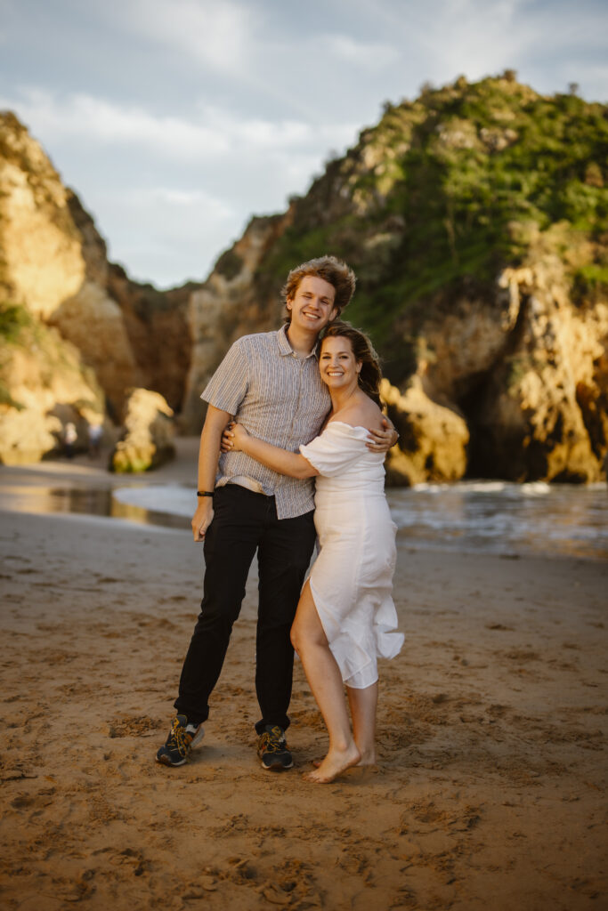 Bride with her brother on the beach in Alvor, Portugal