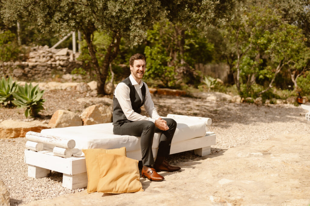 Groom sat down smiling in Loule, Portugal
