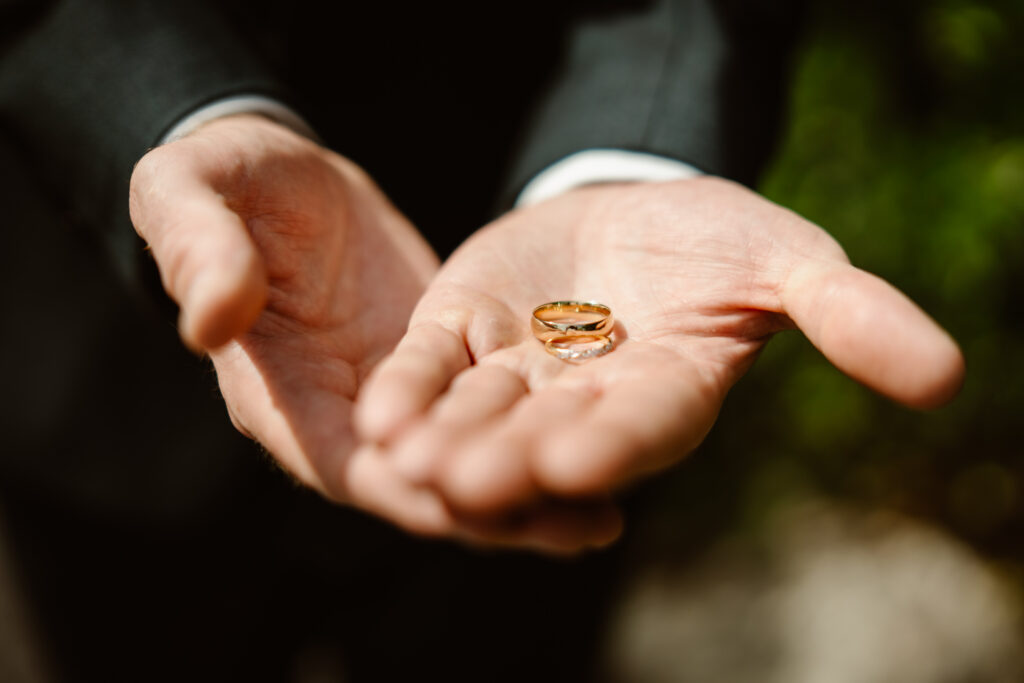Groom holding rings in Loule, Portugal