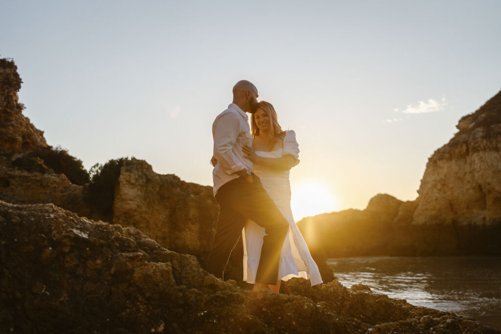 Bride and groom embrace during sunset in Alvor, Portugal