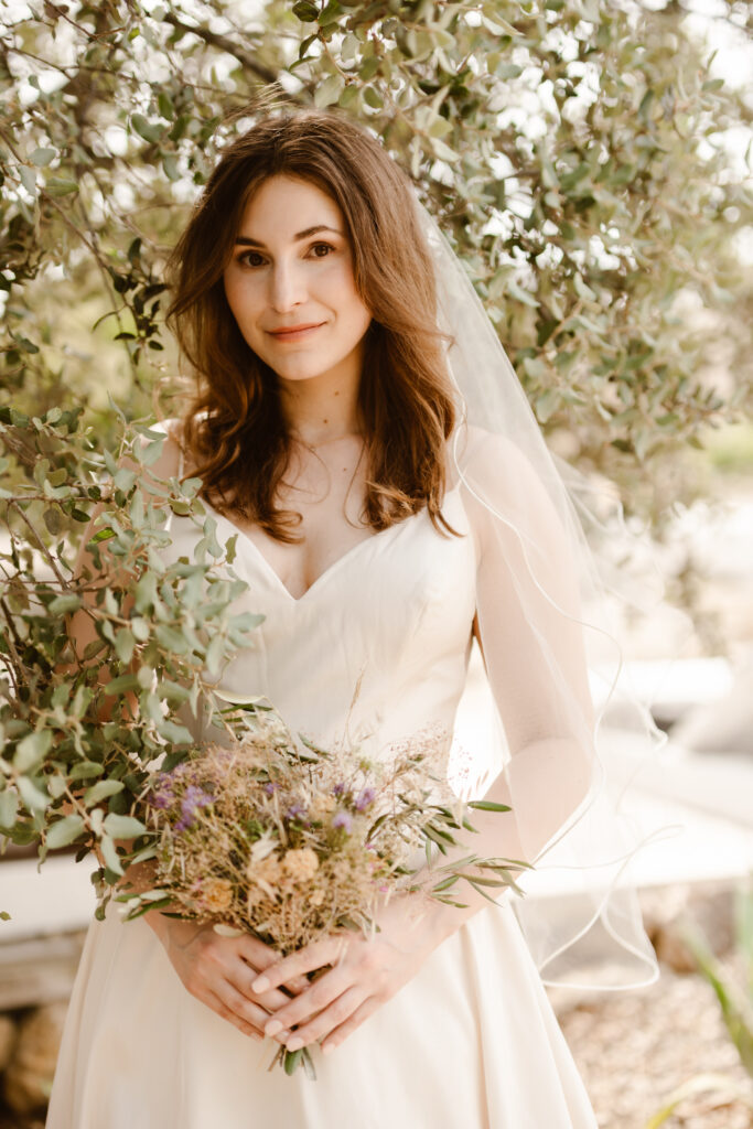 Bride holding bouquet in Loule, Portugal