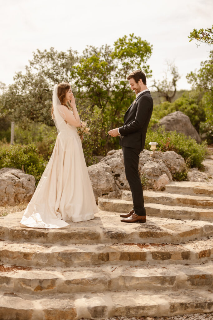 Bride and groom face each other in Loule, Portugal