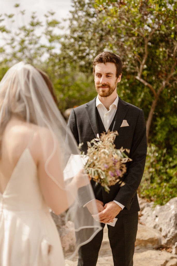 Groom watches bride in Loule, Portugal