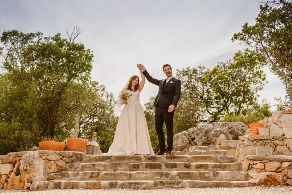 Bride and groom hand holding in Loule, Portugal