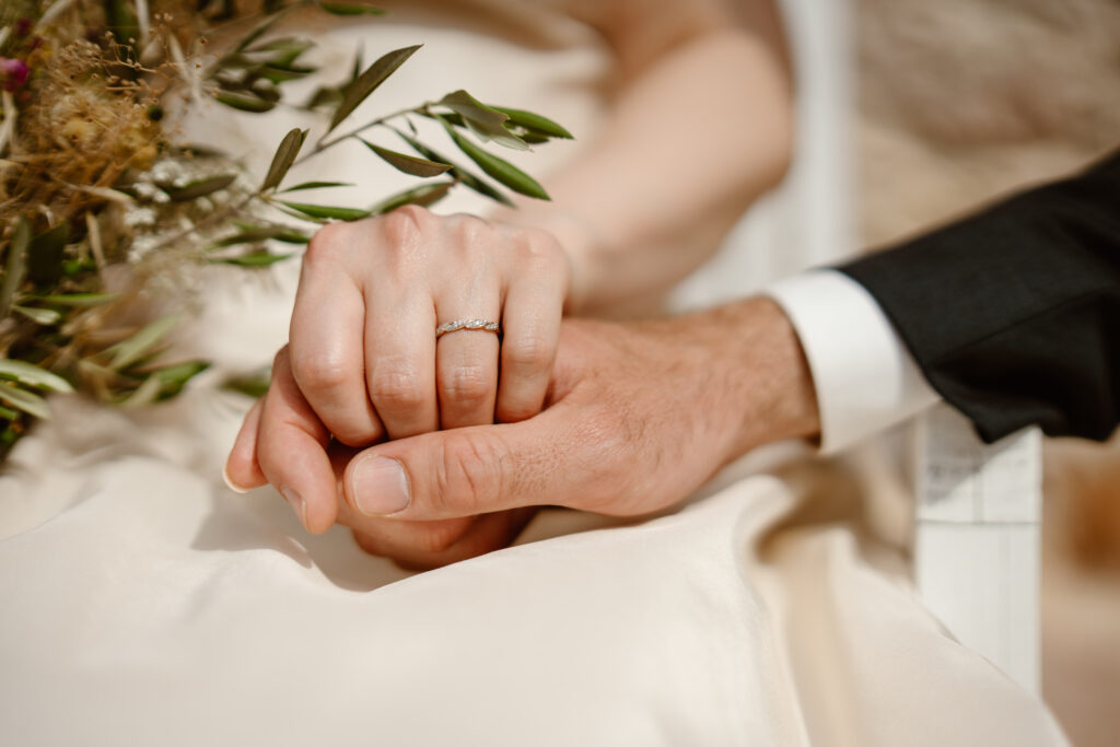 Bride and groom holding hands in Loule, Portugal