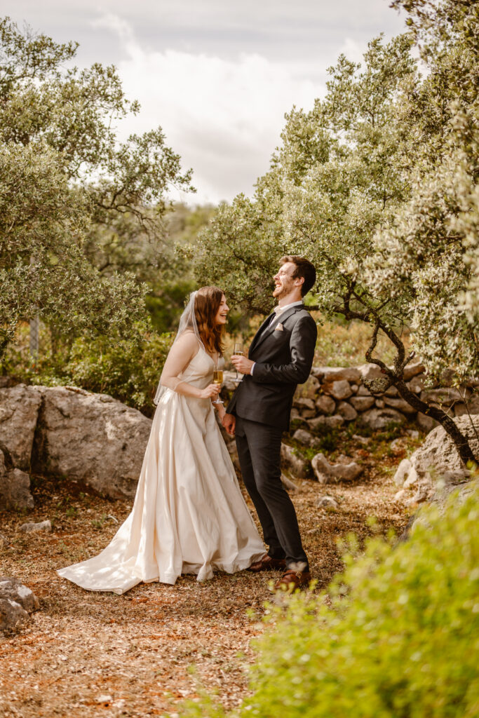 Bride and groom laughing in Loule, Portugal