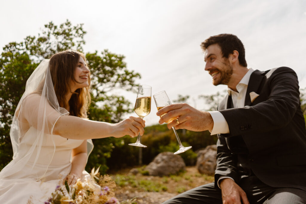 Bride and groom toasting in Loule, Portugal