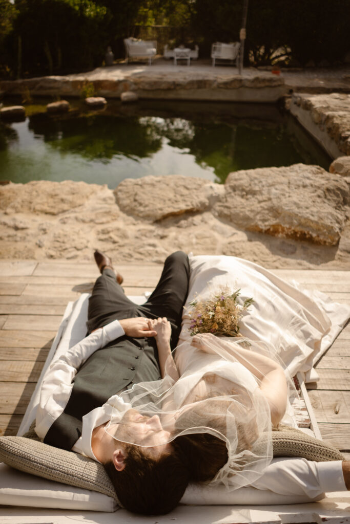 Bride and groom laying down in Loule, Portugal