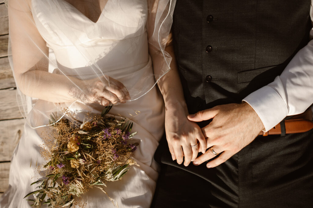 Bride and groom hold hands in Loule, Portugal