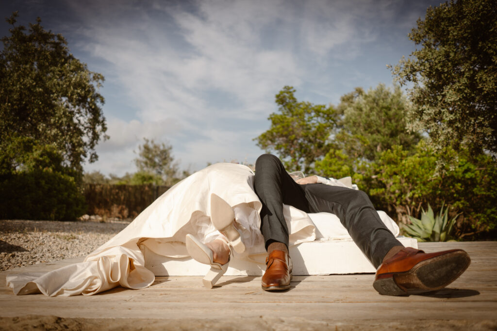 Bride and groom lay down in Loule, Portugal