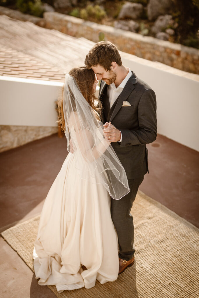 Bride and groom on rooftop in Loule, Portugal