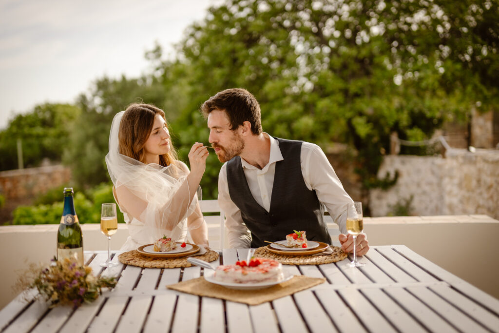 Bride feeds groom in Loule, Portugal