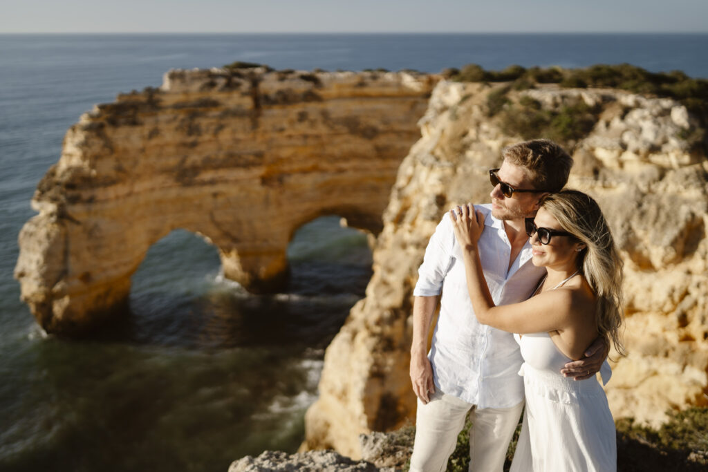 A couple looking out on a cliff