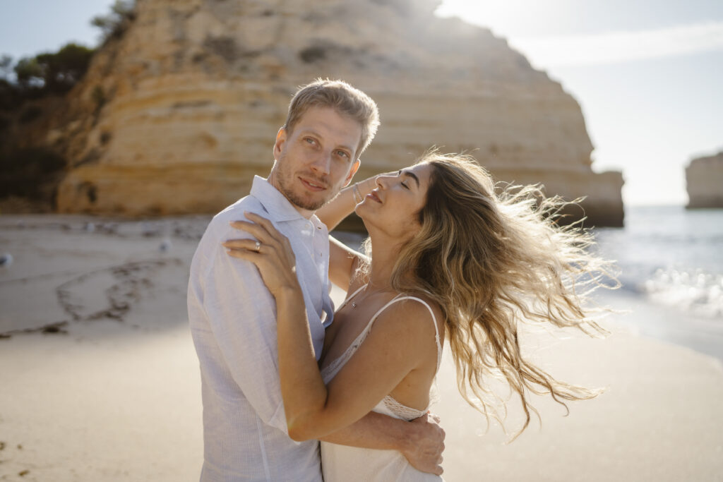 A couple embracing on the beach