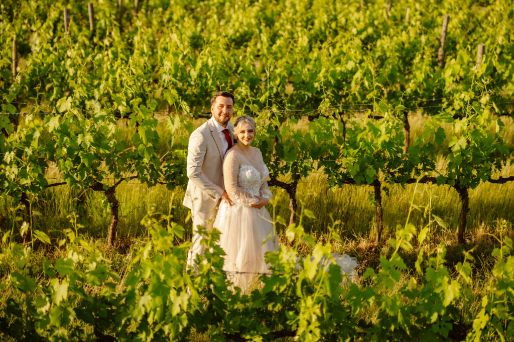 The bride and groom in the vineyard. Elopement in Italy.