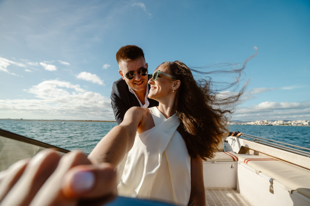 Bride and groom on the boat in Portugal.