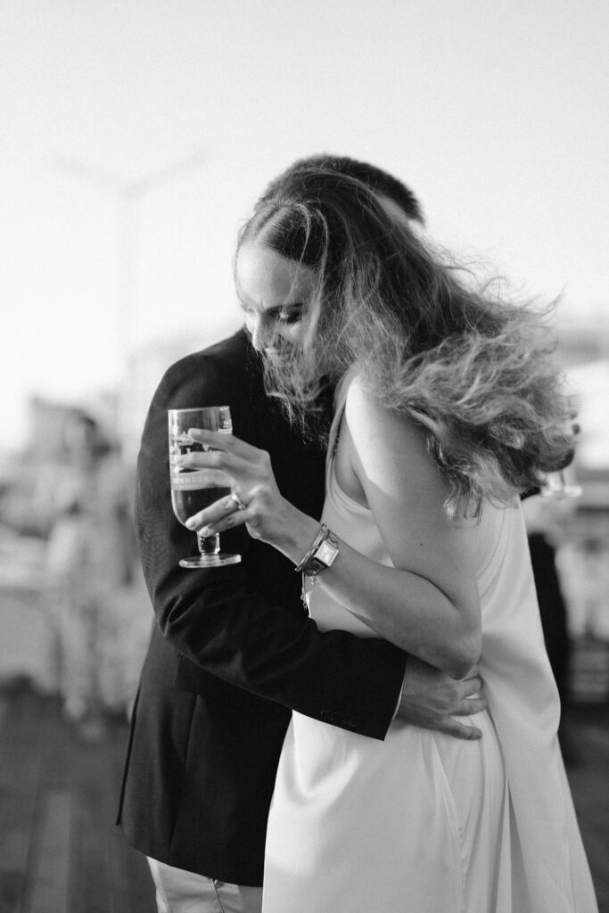 Bride and groom embrace on dance floor in Algarve, Portugal