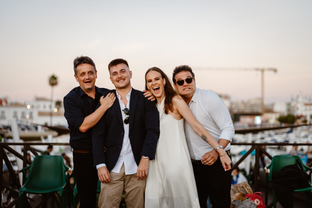 Bride and groom take the funny photo with their friends. Elopement in Portugal.