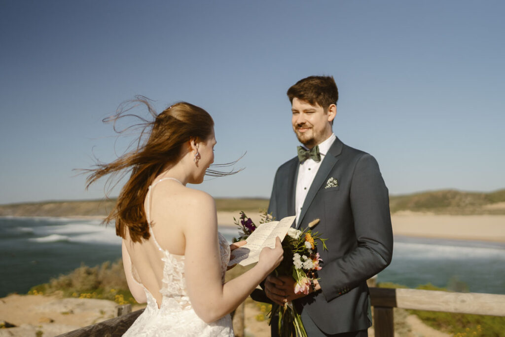 Bride reads her vows in Bordeira, Portugal