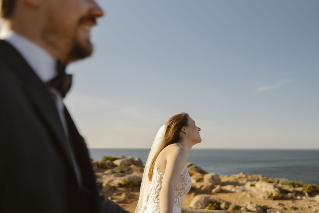 Bride and groom smiling in Bordeira, Portugal