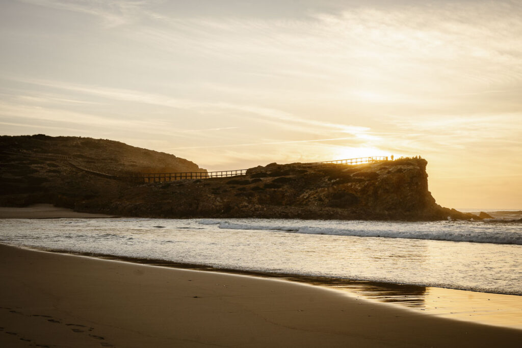 Rocks by ocean in Bordeira, Portugal