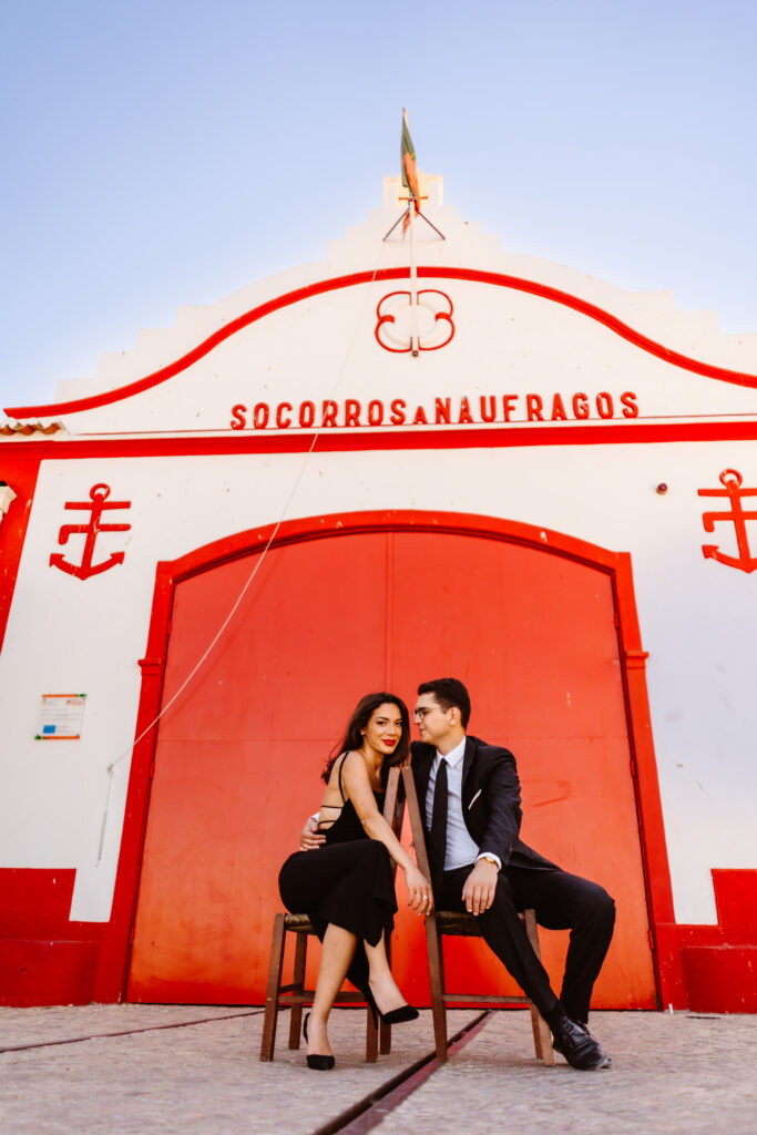 A couple posing in chairs