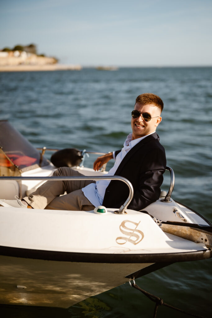 Groom poses in speedboat in Algarve, Portugal