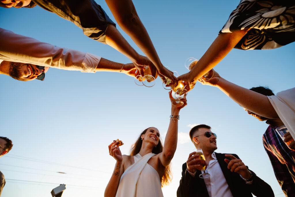 Wedding toast with bride and groom and their friends