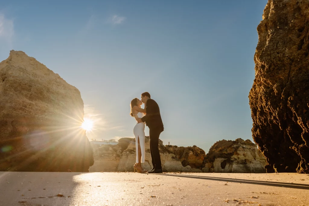 Golden hour kiss during beach elopement in Algarve