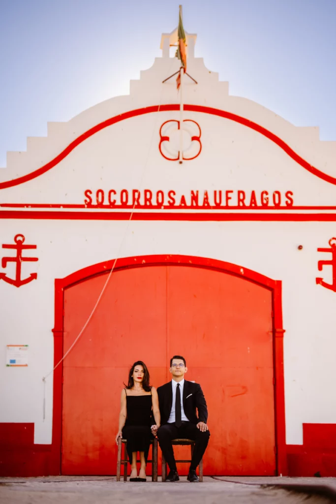 wedding-portrait-in-front-of-red-lifeboat-station-algarve