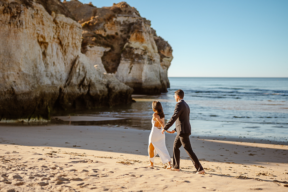 sunrise vs sunset engagement photos algarve couple on cliffs