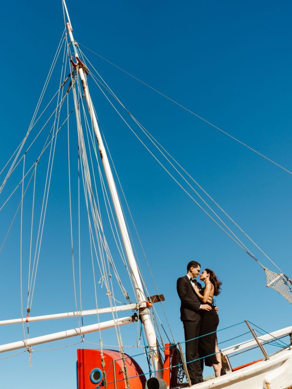 A couple embracing on a boat A couple embracing on a boat